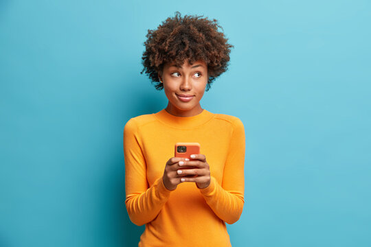 Sending money home on her phone